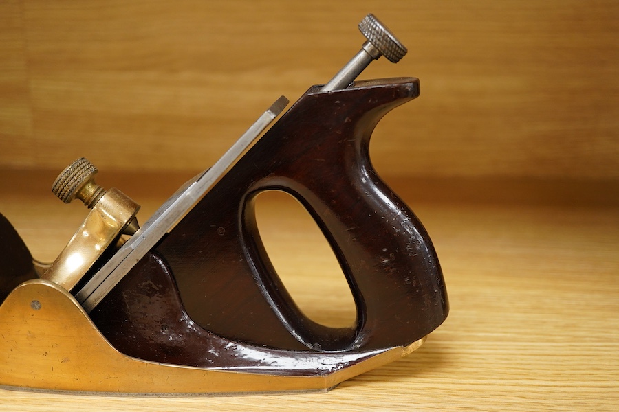 A Norris 50G adjustable gunmetal, steel soled smoothing plane, stamped with Norris, London to both the brass lever cap and the iron, with owner’s name stamped to the handle
